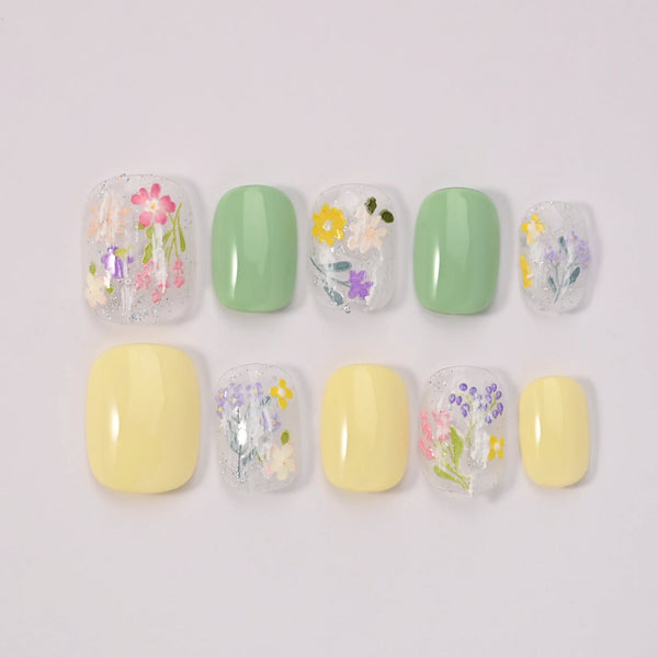 Blubella Dualità Pastello press-on nails bicolore asimmetrico giallo verde con foil olografico premium