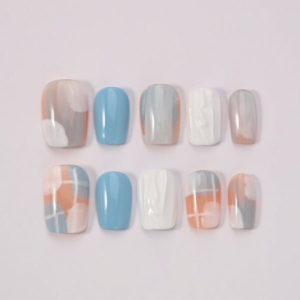 Blubella Geometria Pastello collezione completa press-on nails - 10 design unghie finte riutilizzabili moderne geometriche azzurro grigio arancio qualità artigianale